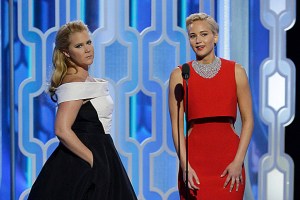 BEVERLY HILLS, CA - JANUARY 10: In this handout photo provided by NBCUniversal, Presenters Amy Schumer and Jennifer Lawrence speak onstage during the 73rd Annual Golden Globe Awards at The Beverly Hilton Hotel on January 10, 2016 in Beverly Hills, California. (Photo by Paul Drinkwater/NBCUniversal via Getty Images)